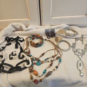 Multiple pieces of costume jewelry